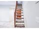 Carpeted staircase leading to upper level with railing; adjacent doorway to living area at 8635 W Country Gables Dr, Peoria, AZ 85381