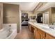 This primary bathroom features dual sinks with an attached en-suite bedroom at 9343 W Quail Ave, Peoria, AZ 85382
