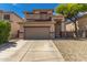 Charming two-story home featuring a two car garage, concrete driveway, and well kept landscaping at 9343 W Quail Ave, Peoria, AZ 85382