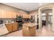Well-equipped kitchen with granite countertops, stainless steel appliances, and tile flooring at 9343 W Quail Ave, Peoria, AZ 85382