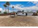 Expansive backyard showcasing a gazebo, block wall, and mature palm trees at 9609 N 44Th Ave, Glendale, AZ 85302