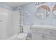Bathroom featuring updated vanity, mirror, tub and shower combo at 9609 N 44Th Ave, Glendale, AZ 85302