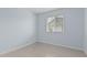 Bedroom featuring tiled floors, a window with blinds, and light-blue walls at 9609 N 44Th Ave, Glendale, AZ 85302