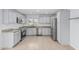 Bright kitchen with stainless steel appliances, granite countertops, subway tile backsplash, and tile floors at 9609 N 44Th Ave, Glendale, AZ 85302