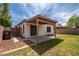 Enjoy the private yard with covered patio, low maintenance desert landscaping, and block wall fencing at 10808 W Ruth Ave, Peoria, AZ 85345