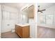 Bathroom features a light wood vanity and a view to the adjoining bedroom at 10808 W Ruth Ave, Peoria, AZ 85345