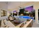 Outdoor lounge area with stylish seating, a pool, fire pit, and night lighting at 11331 E Cochise Dr, Scottsdale, AZ 85259