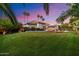 Lush backyard with a pool, spa, lounge chairs, and ample space for outdoor activities, creating a private and inviting retreat at 11331 E Cochise Dr, Scottsdale, AZ 85259