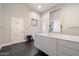 Bright primary bathroom featuring a contemporary vanity with double sinks and elegant fixtures for an open and spa-like feel at 11331 E Cochise Dr, Scottsdale, AZ 85259