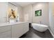Contemporary primary bathroom with modern fixtures, freestanding tub, and neutral finishes for spa-like experience at 11331 E Cochise Dr, Scottsdale, AZ 85259