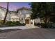 Inviting entrance featuring a paver walkway, mature trees, and manicured landscaping at 11331 E Cochise Dr, Scottsdale, AZ 85259