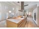 Spacious modern kitchen with large island, high ceilings, and abundant natural light at 11331 E Cochise Dr, Scottsdale, AZ 85259
