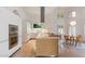 Bright, modern kitchen with white cabinetry, stainless steel appliances, and a dining area at 11331 E Cochise Dr, Scottsdale, AZ 85259