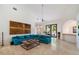 Spacious living room featuring a blue sectional, high ceilings, and travertine floors at 11331 E Cochise Dr, Scottsdale, AZ 85259