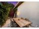 Outdoor patio with seating area, dining table, and beautiful bougainvillea at 11331 E Cochise Dr, Scottsdale, AZ 85259