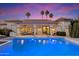 Beautiful backyard with a sparkling pool, covered patio, and comfortable outdoor seating, perfect for enjoying sunny days and warm evenings at 11331 E Cochise Dr, Scottsdale, AZ 85259