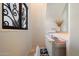 Well-appointed wet bar with built-in storage, a drink refrigerator, and designer finishes at 11331 E Cochise Dr, Scottsdale, AZ 85259