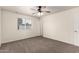 Cozy bedroom featuring carpet, a ceiling fan, a window, and white walls and baseboards at 1203 E Bishop Dr, Tempe, AZ 85282