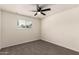 Bedroom featuring carpet, a ceiling fan, and a window bringing in natural light at 1203 E Bishop Dr, Tempe, AZ 85282