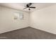 Bedroom with neutral walls, carpet, window, and ceiling fan at 1203 E Bishop Dr, Tempe, AZ 85282