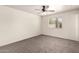 Cozy bedroom featuring carpet, a ceiling fan, a window, and white walls at 1203 E Bishop Dr, Tempe, AZ 85282