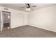 Bedroom featuring neutral walls, carpet, ceiling fan, and a view to another room at 1203 E Bishop Dr, Tempe, AZ 85282