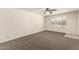 Bright living room featuring neutral carpet and a large window at 1203 E Bishop Dr, Tempe, AZ 85282