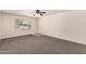 Bright living room featuring neutral carpet and a large window at 1203 E Bishop Dr, Tempe, AZ 85282