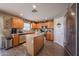 Kitchen featuring an island, stainless steel appliances, and ample cabinet space at 12513 W Dreyfus Dr, El Mirage, AZ 85335