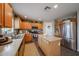Bright kitchen with an island, stainless steel appliances, and lots of storage at 12513 W Dreyfus Dr, El Mirage, AZ 85335