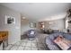 Comfortable living space with two papasan chairs and an open view into dining area at 12513 W Dreyfus Dr, El Mirage, AZ 85335