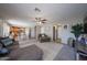 Open-concept living space showcasing the seamless flow between living room, dining area, and kitchen at 12513 W Dreyfus Dr, El Mirage, AZ 85335
