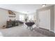 Cozy living area with bar and shelves, featuring papasan chairs and natural light at 12513 W Dreyfus Dr, El Mirage, AZ 85335