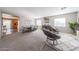 Bright, spacious living area with carpet floors and stylish decor at 12513 W Dreyfus Dr, El Mirage, AZ 85335