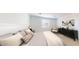 Serene bedroom with a plush bed, modern furniture, and soft natural light, creating a relaxing ambiance at 12576 W Trumbull Rd, Avondale, AZ 85323