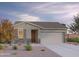 Charming single-Gathering home boasting stone accents, a neutral color palette, and a well-manicured front yard at 12576 W Trumbull Rd, Avondale, AZ 85323
