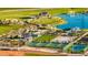A close-up of the park, featuring a pond, splash pad, covered seating, sport courts, and a playground at 12576 W Trumbull Rd, Avondale, AZ 85323