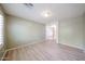 Bright bedroom with neutral paint and wood floors, ready for your personal touch at 12845 W Milton Dr, Peoria, AZ 85383