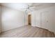 Light and airy bedroom featuring wood floors and a closet at 12845 W Milton Dr, Peoria, AZ 85383