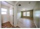 Comfortable bedroom featuring a neutral color palette, wood floors, and ample natural light at 12845 W Milton Dr, Peoria, AZ 85383