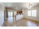 Open dining area featuring tile flooring, vaulted ceilings, and bright natural light through large windows and sliding glass door at 12845 W Milton Dr, Peoria, AZ 85383