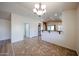 Bright dining area featuring tile floors, modern lighting, and convenient kitchen access at 12845 W Milton Dr, Peoria, AZ 85383