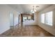 Bright dining area featuring tile floors, modern lighting, and easy kitchen access at 12845 W Milton Dr, Peoria, AZ 85383