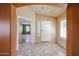 Inviting foyer with tile flooring, arched doorways, and a bright entry at 12845 W Milton Dr, Peoria, AZ 85383