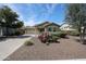 Charming single-story home with desert landscaping and a two-car garage at 12845 W Milton Dr, Peoria, AZ 85383