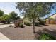 Charming home featuring a well-maintained front yard with desert landscaping at 12845 W Milton Dr, Peoria, AZ 85383