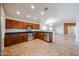 Modern kitchen with stainless steel appliances, wooden cabinetry, and sleek countertops at 12845 W Milton Dr, Peoria, AZ 85383