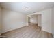 Bright living room features stylish flooring, archways leading to other rooms, and lots of natural light at 12845 W Milton Dr, Peoria, AZ 85383