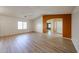 Bright living room with vaulted ceilings, light wood floors, and natural light at 12845 W Milton Dr, Peoria, AZ 85383