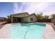 Backyard featuring a refreshing pool, covered patio, and low-maintenance landscaping at 12845 W Milton Dr, Peoria, AZ 85383